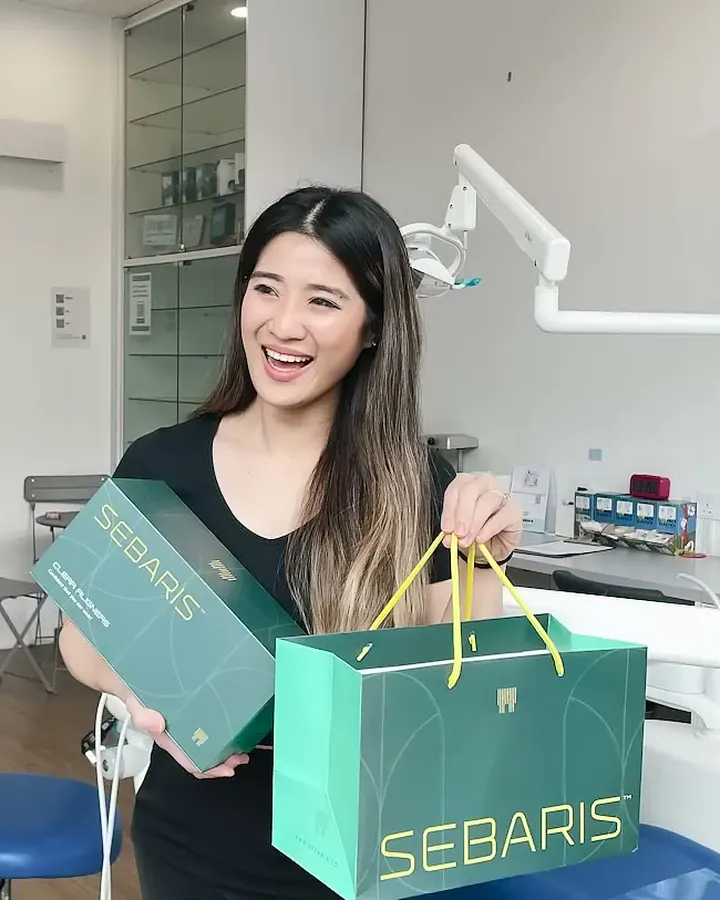 Patient collecting a Sebaris bag and box